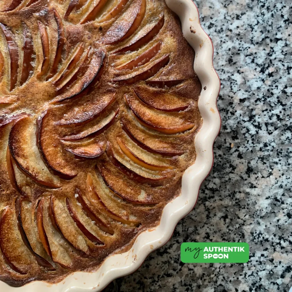 sugar-free apple clafoutis with a glossy egg and vanilla glaze, ready to slice