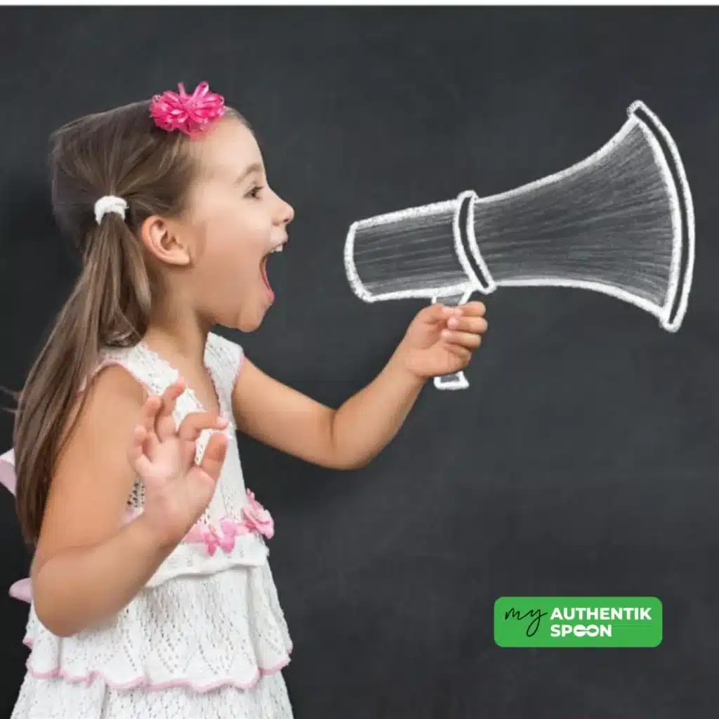 Young girl shouting into a drawn megaphone on a chalkboard, symbolizing emotional overwhelm and back to school anxiety