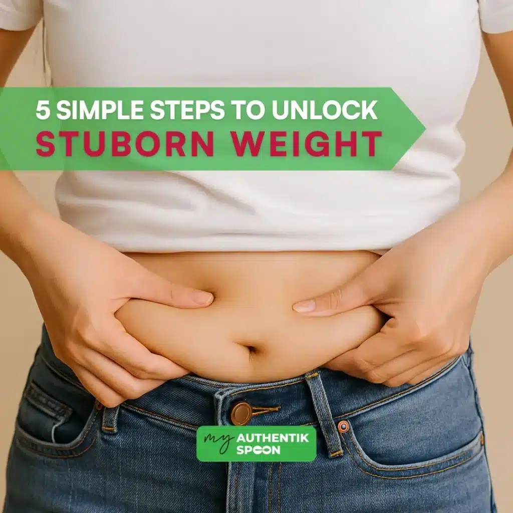 Woman holding her belly symbolizing belly fat resistance.