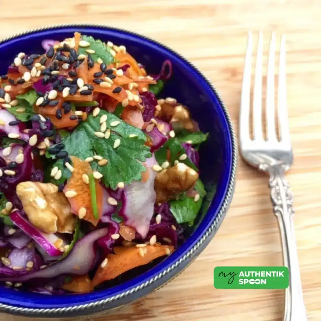 Colorful hormonal balance detox salad made with grated beetroot, red cabbage, carrots, citrus, seaweed, fresh herbs, walnuts, and seeds. A fiber-rich, anti-inflammatory salad that supports liver detox, gut health, blood sugar balance, and weight loss.