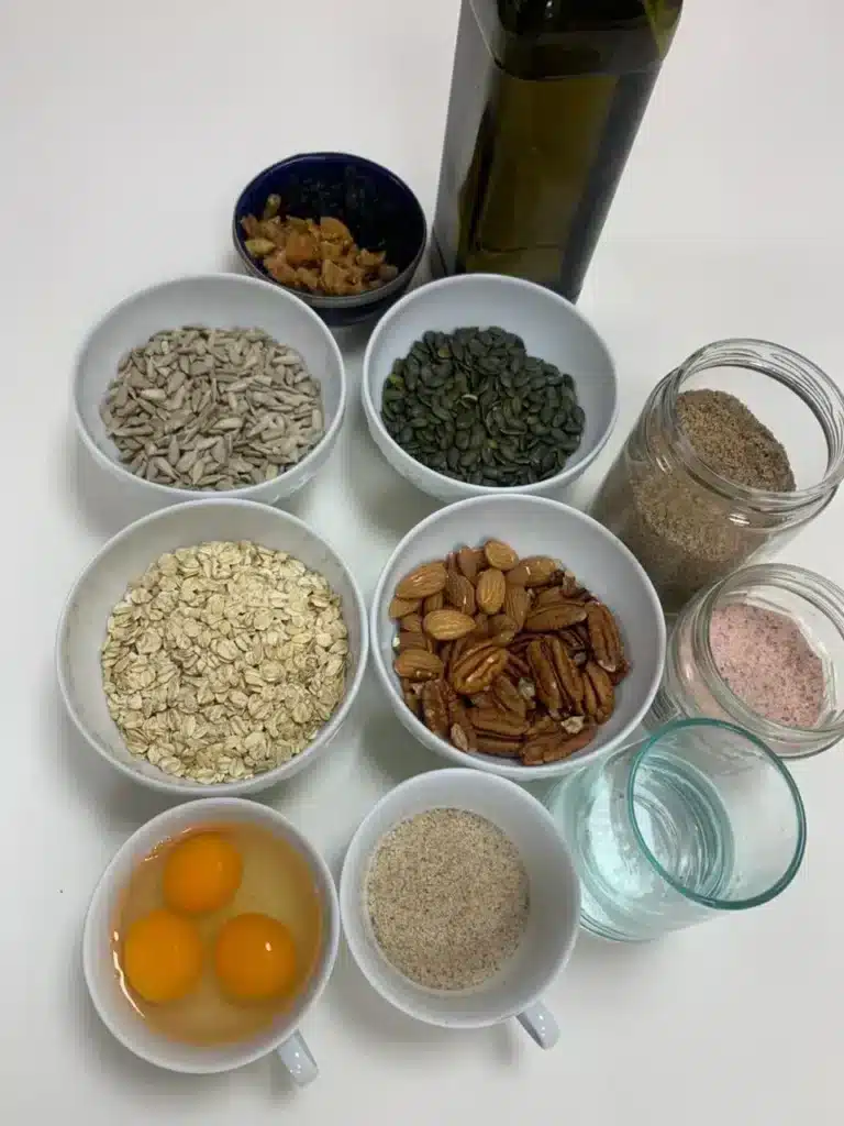 Ingredients for flour-free high protein bread with flaxseed, psyllium, nuts, and oats