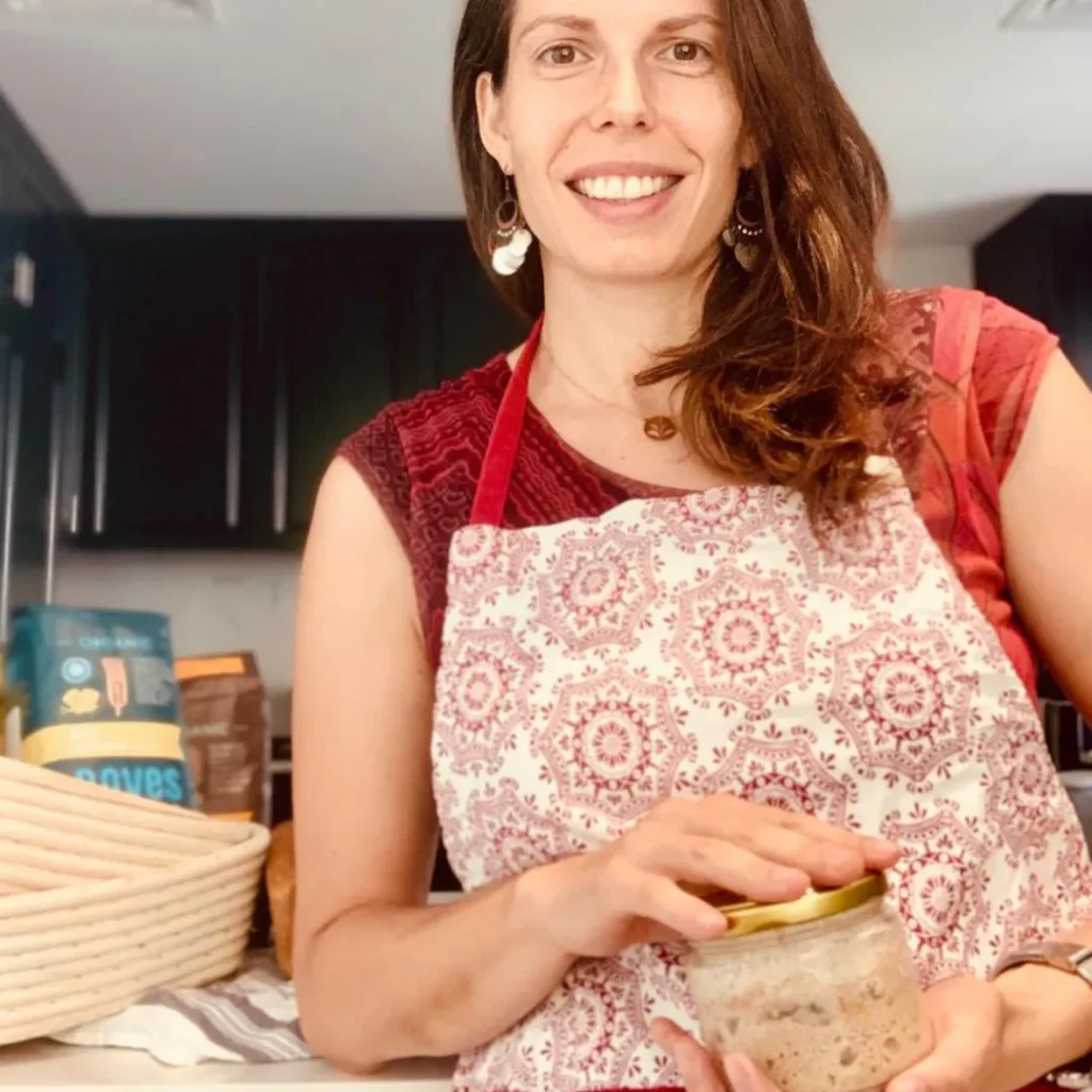 Sourdough bread benefits begin with fermentation as Gaelle Millard holds her traditional sourdough starter