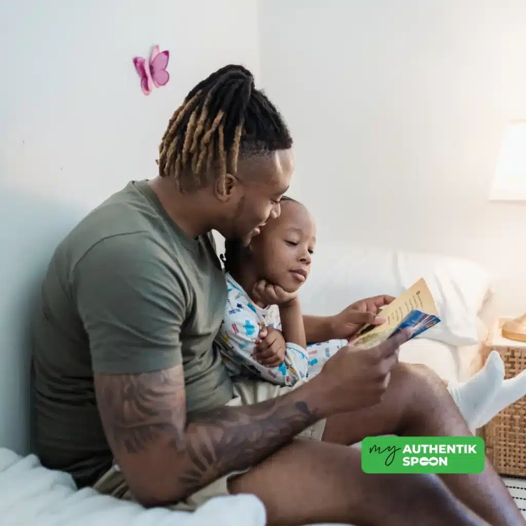 Father reading a bedtime story to his child as part of a calming evening routine for better sleep and hormonal balance