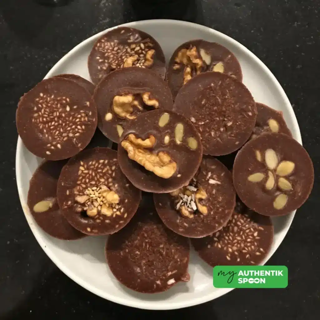 Healthy chocolate bites made with raw cacao, nuts and seeds for balanced energy and reduced cravings