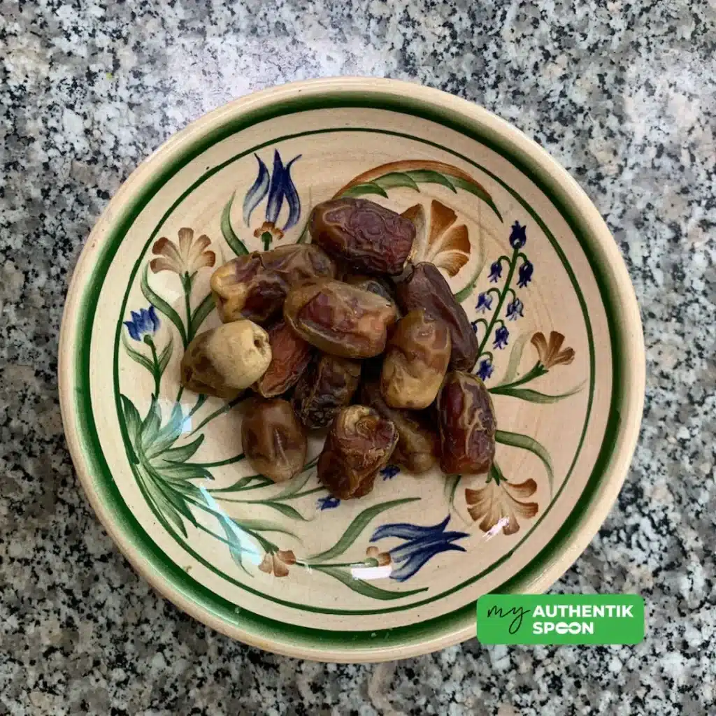 Pitted dates in a bowl for healthy chocolate date cake recipe natural sweetness and fiber
