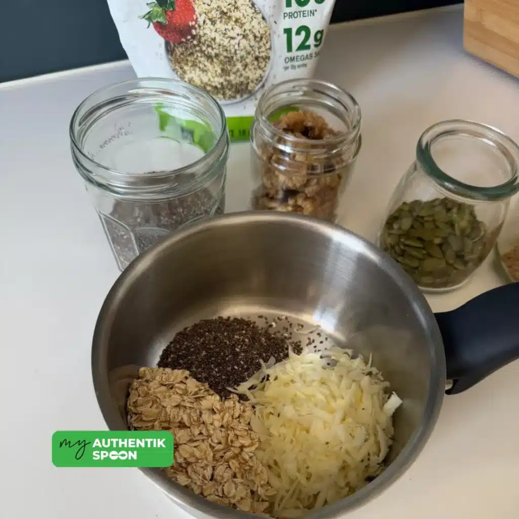 Ingredients for a hormone balancing breakfast bowl with oats, grated parsnip, chia seeds, walnuts and pumpkin seeds to support gut health, energy and anti-inflammatory nutrition.