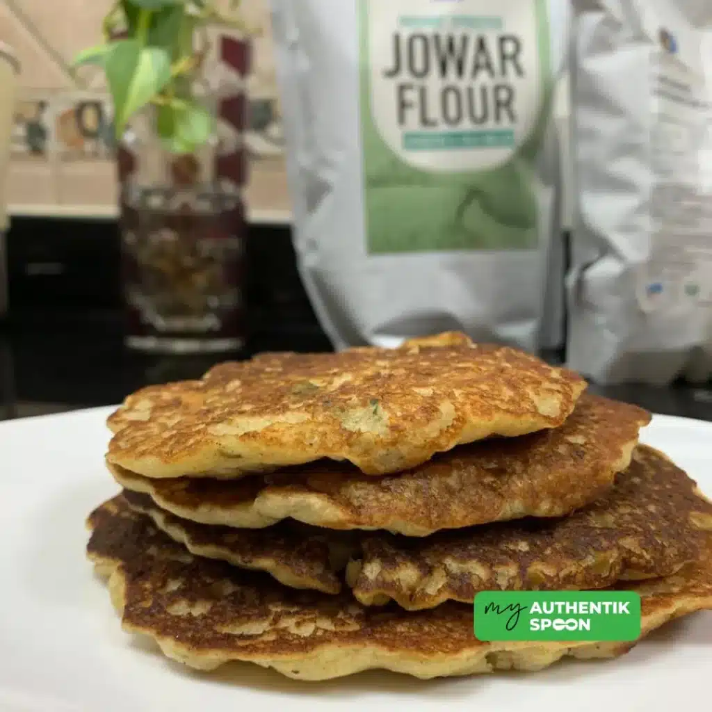 Gut-friendly kimchi pancakes stacked on a plate, made with sourdough and fermented ingredients.