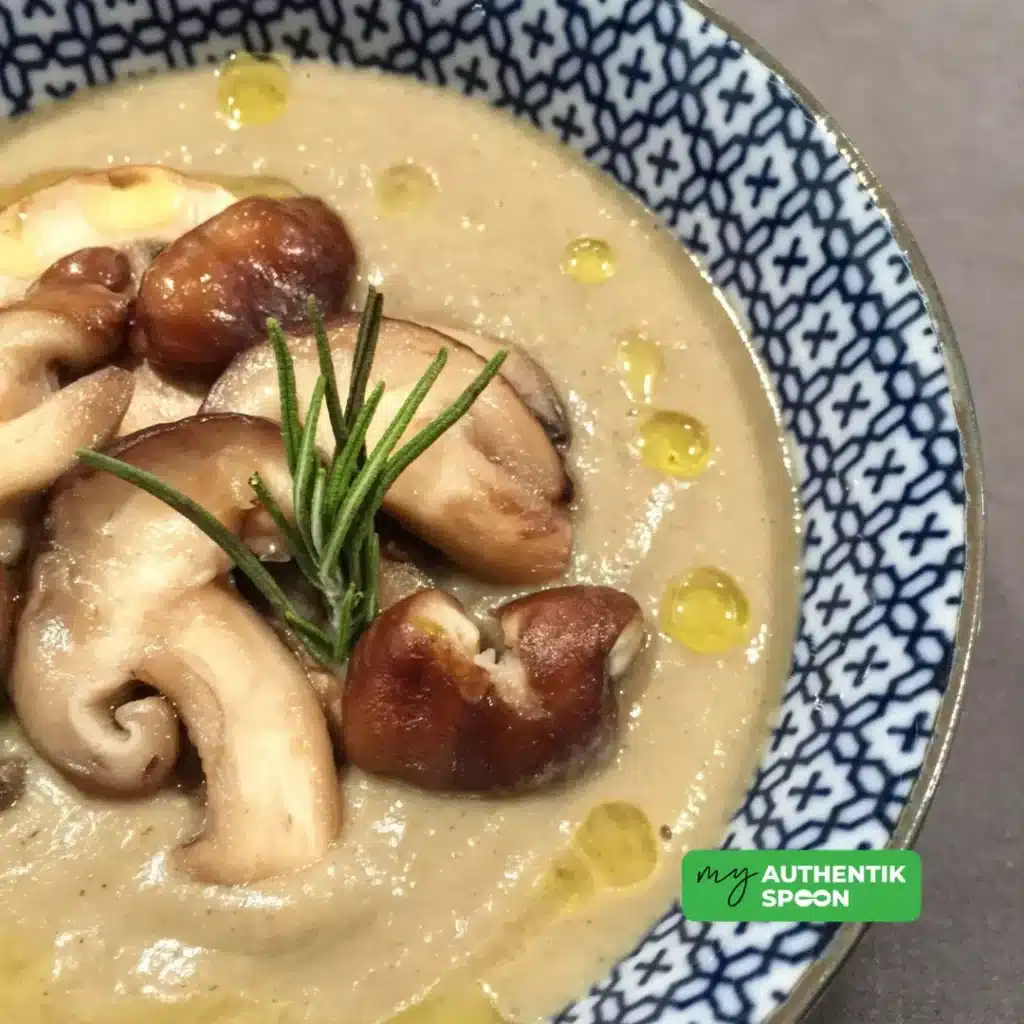 Ramadan Healthy Soup Recipe with wild mushrooms, white beans, fresh rosemary and olive oil drizzle in a patterned bowl
