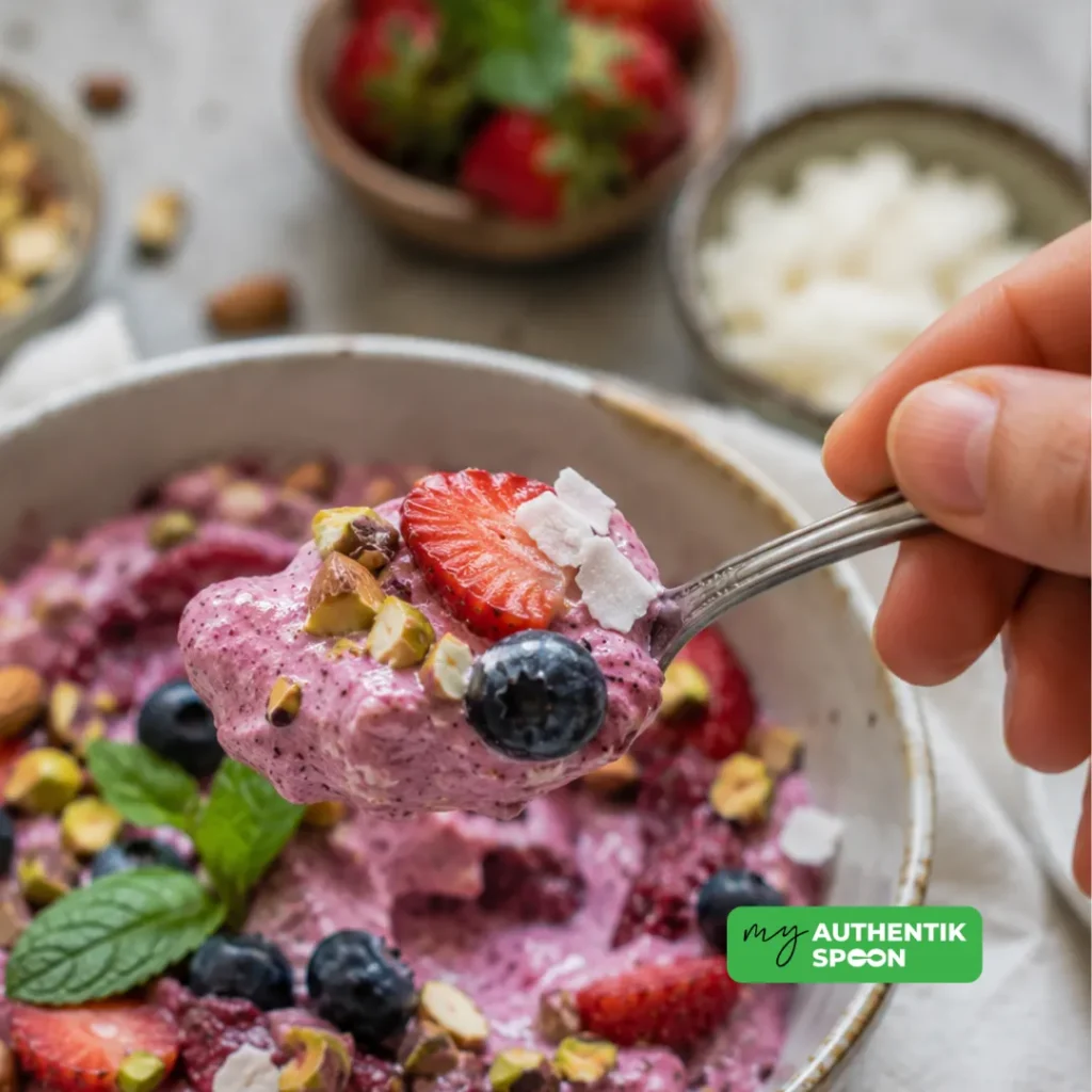 Creamy High Protein Frozen Yogurt Recipe served with fresh berries and crunchy nuts