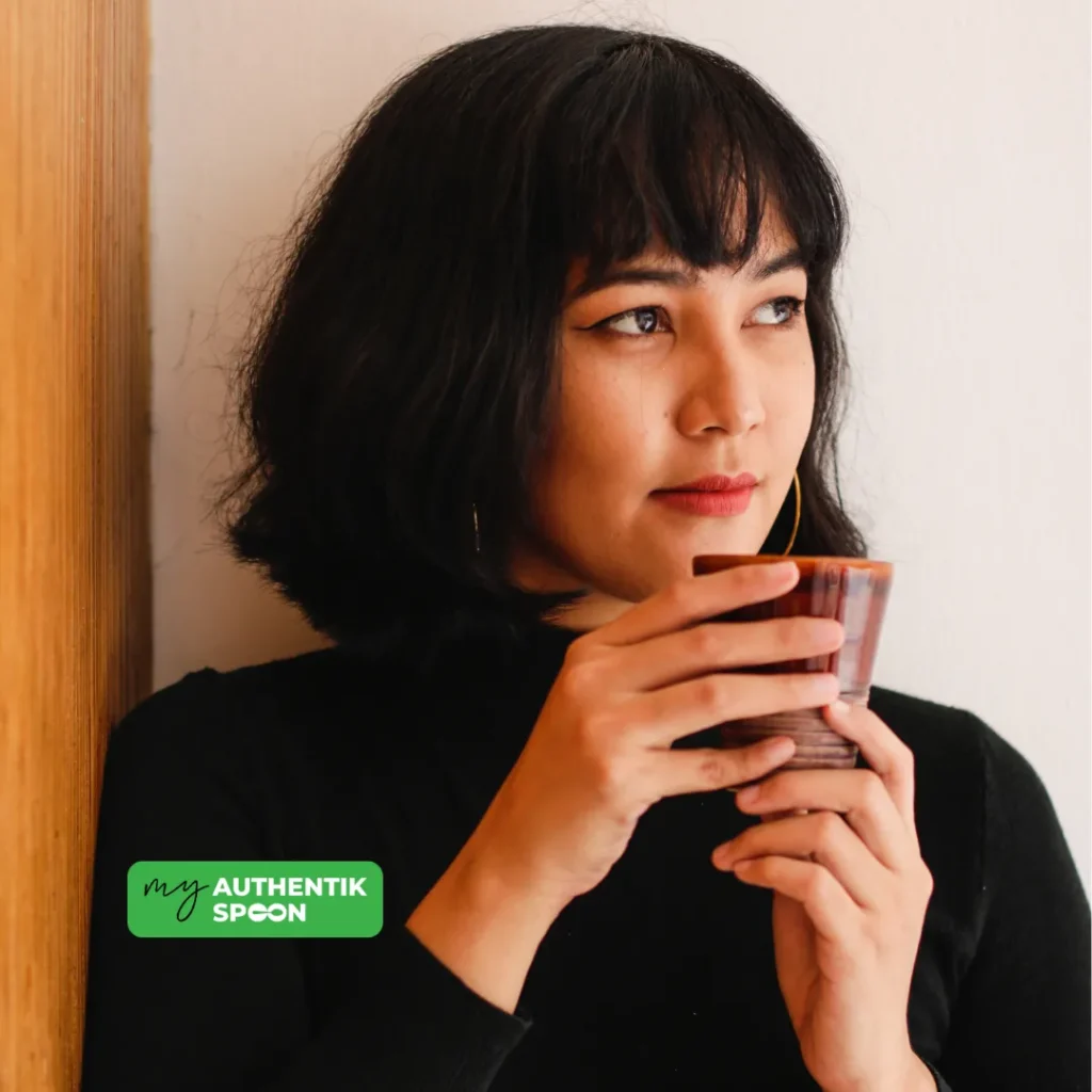 hormone balance after 35, woman enjoying a calm moment with a warm drink